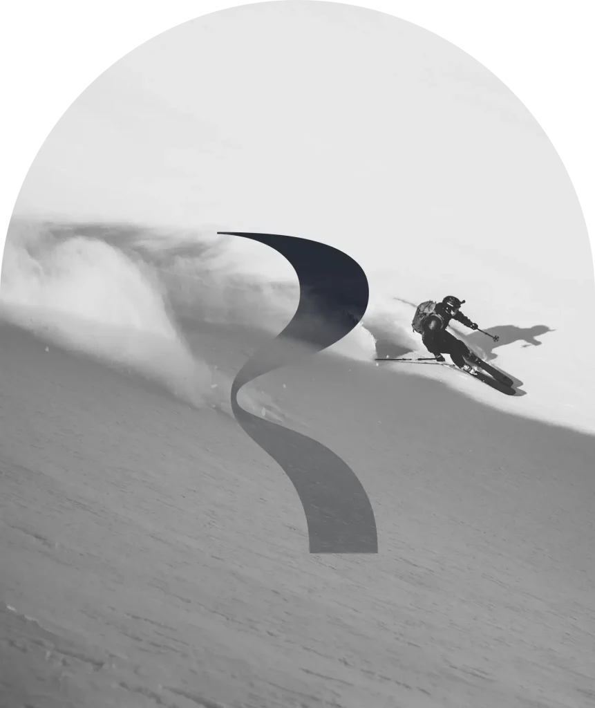A skier hurtling down a snow-covered slope in a cloud of powder snow; black-and-white photo with a decorative graphic element